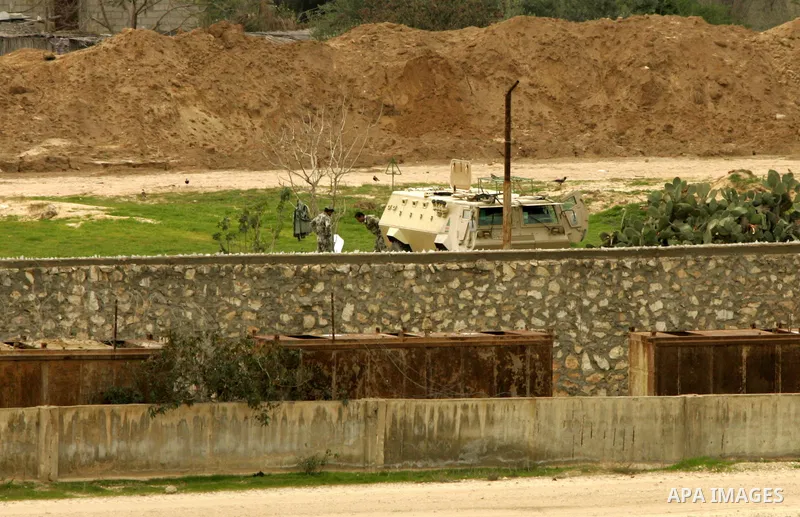 Egyptian soldiers patrol with their army vehicles along their side of the frontier in this picture taken from the southern Gaza Strip town of Rafah on February 13, 2011. Photo by Abed Rahim Khatib