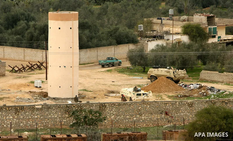 Egyptian soldiers patrol with their army vehicles along their side of the frontier in this picture taken from the southern Gaza Strip town of Rafah on February 13, 2011. Photo by Abed Rahim Khatib