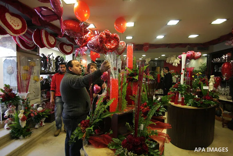 A Palestinian vendor prepares gifts for Valentine's Day at his shop in the biblical town of Bethlehem, on February 13, 2011. Valentine's Day marks a Christian holiday on Feb, 14.. Photo by Najeh Hashlamoun