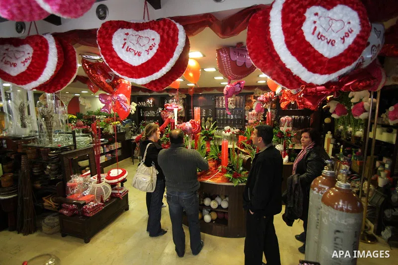 A Palestinian vendor prepares gifts for Valentine's Day at his shop in the biblical town of Bethlehem, on February 13, 2011. Valentine's Day marks a Christian holiday on Feb, 14.. Photo by Najeh Hashlamoun
