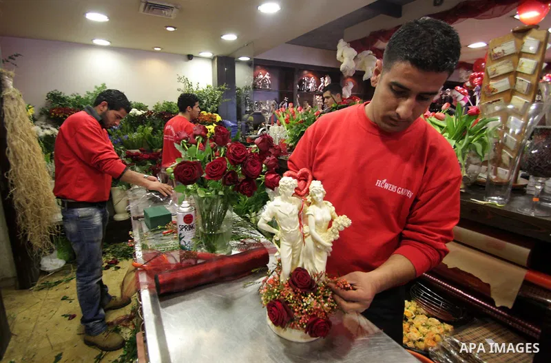A Palestinian vendor prepares gifts for Valentine's Day at his shop in the biblical town of Bethlehem, on February 13, 2011. Valentine's Day marks a Christian holiday on Feb, 14.. Photo by Najeh Hashlamoun