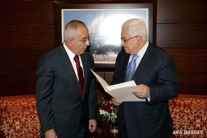 Palestinian Prime Minister Salam Fayyad as he submits his government's resignation to Palestinian President Mahmoud Abbas in Abbas' offices in the West Bank town of Ramallah, 14 February 2011. Abbas asked Fayyad to form...