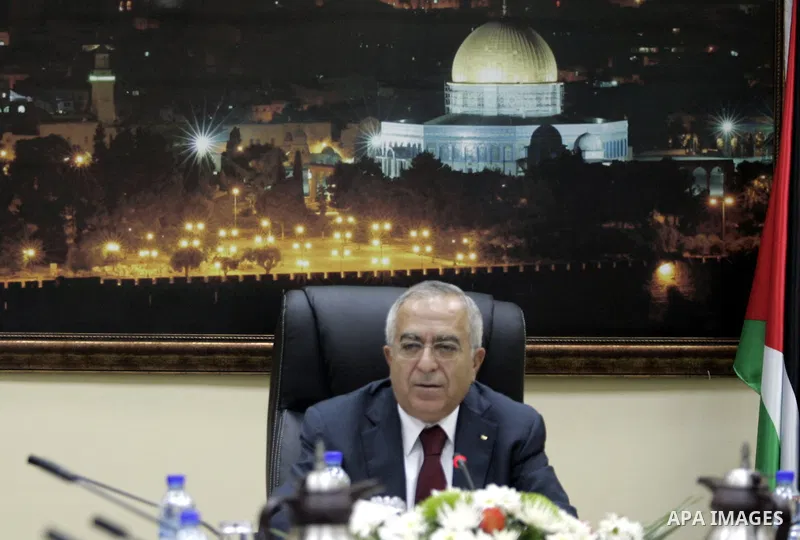 Palestinian Prime Minister Salam Fayyad heads the Palestinian cabinet meeting in the West Bank city of Ramallah on Feb. 14,2011. Photo by Mustafa Abu Dayeh