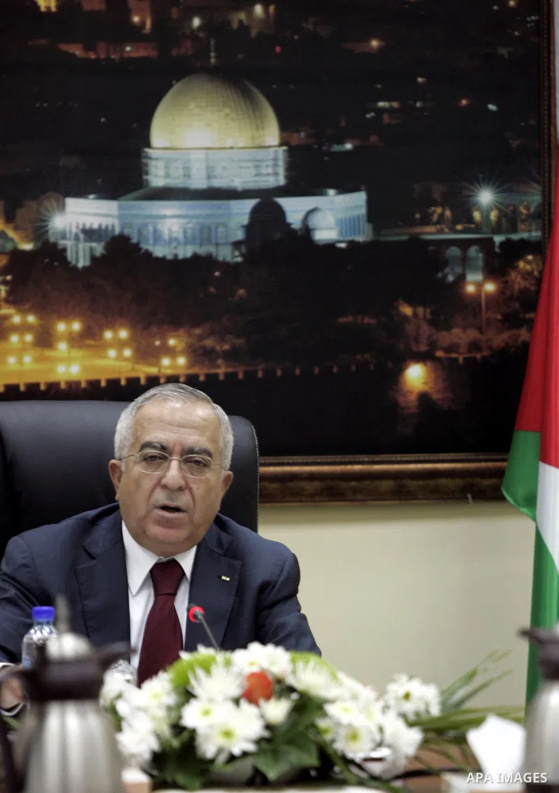 Palestinian Prime Minister Salam Fayyad heads the Palestinian cabinet meeting in the West Bank city of Ramallah on Feb. 14,2011. Photo by Mustafa Abu Dayeh