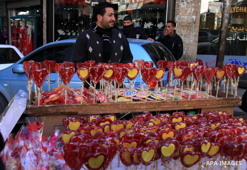 A Palestinian man sells sweets in the Valentine's Day in the West Bank city of Nablus February 14, 2011. Photo by Wagdi Eshtayah