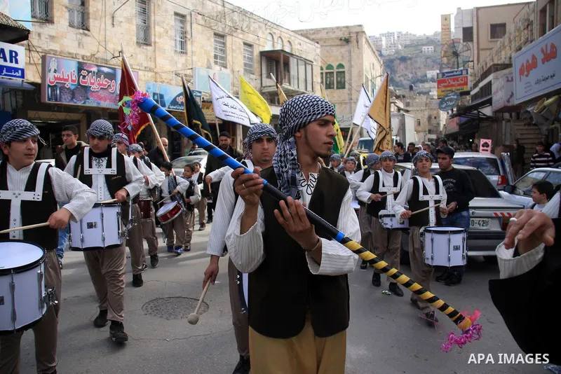 Palestinian Muslims celebrate the anniversary of the Prophet Muhammad birth in the West Bank city of Nablus, Tuesday, Feb. 15, 2011. Photo by Wagdi Eshtayah
