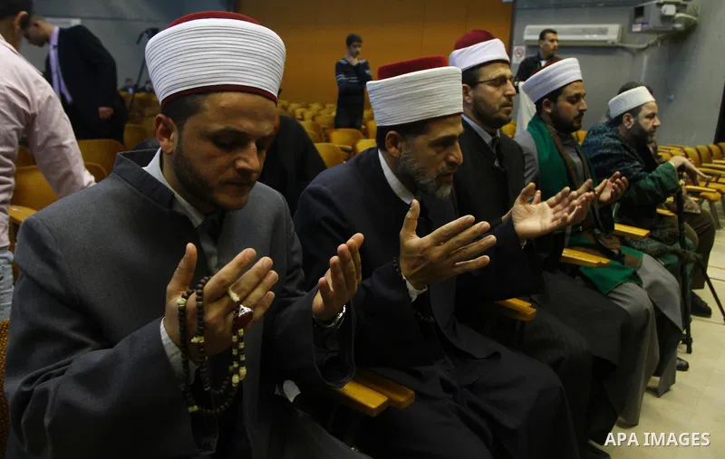 Palestinians attend a ceremony commemorating the birth of Prophet Muhammad, known in Arabic as Mawlid al-Nabawi, at the Shawwa Theatre in Gaza City on Feb. 15, 2011. Photo by Ashraf Amra