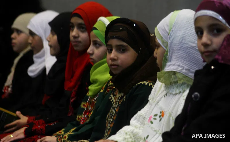Palestinian girls attend a ceremony commemorating the birth of Prophet Muhammad, known in Arabic as Mawlid al-Nabawi, at the Shawwa Theatre in Gaza City on Feb. 15, 2011. Photo by Ashraf Amra