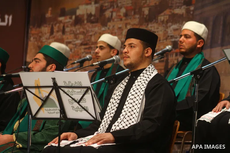 Palestinian youths sing Islamic songs during a ceremony commemorating the birth of Prophet Muhammad, known in Arabic as Mawlid al-Nabawi, at the Shawwa Theatre in Gaza City on Feb. 15, 2011. Photo by Ashraf Amra