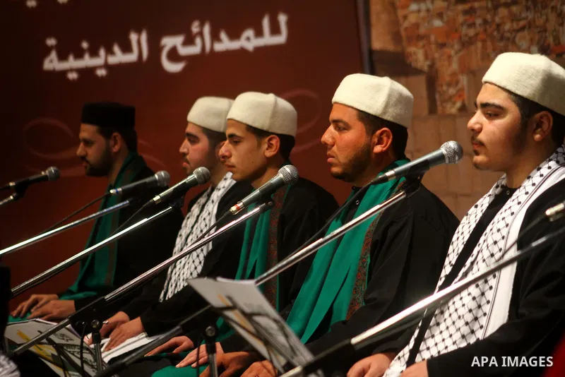 Palestinian youths sing Islamic songs during a ceremony commemorating the birth of Prophet Muhammad, known in Arabic as Mawlid al-Nabawi, at the Shawwa Theatre in Gaza City on Feb. 15, 2011. Photo by Ashraf Amra