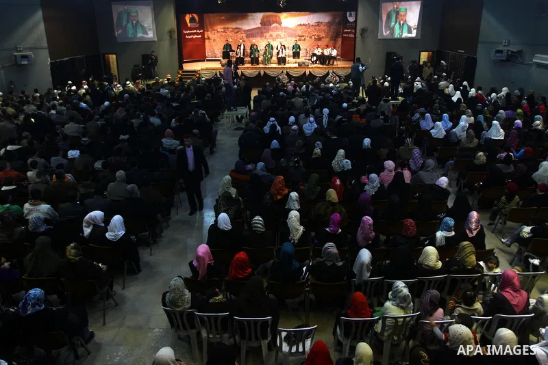 Palestinians attend a ceremony commemorating the birth of Prophet Muhammad, known in Arabic as Mawlid al-Nabawi, at the Shawwa Theatre in Gaza City on Feb. 15, 2011. Photo by Ashraf Amra
