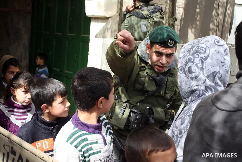 Palestinians go to Ibrahimi mosque as they march in a procession to mark the birth anniversary of Islam's prophet Mohammed, in the West Bank city of Hebron Tuesday, Feb. 15, 2011. Muslims celebrate Prophet Mohammed's bir...