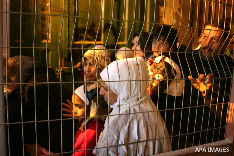 Palestinians go to Ibrahimi mosque as they march in a procession to mark the birth anniversary of Islam's prophet Mohammed, in the West Bank city of Hebron Tuesday, Feb. 15, 2011. Muslims celebrate Prophet Mohammed's bir...
