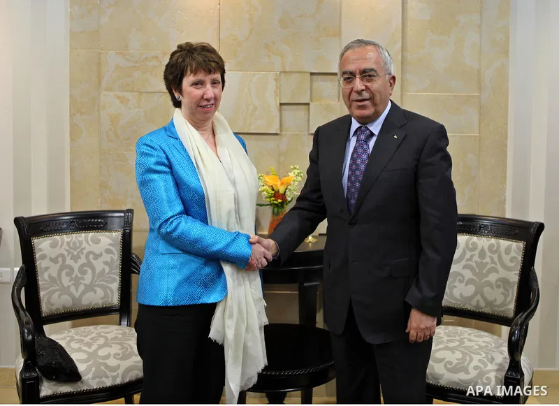 Palestinian Prime Minister Salam Fayyad (R) shakes hands with with Catherine Ashton (L), High Representative for Foreign Affairs and Security Policy of the European Union, in the West Bank city of Ramallah, on Feb. 15, 2...