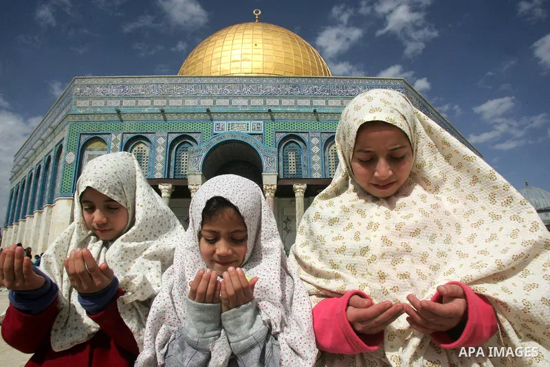 Palestinian Muslims celebrate the anniversary of the prophet Mohammed birth at the Al-Aqsa Mosque compound in Jerusalem on Feb. 15,2011. Photo by Mahfouz Abu Turk