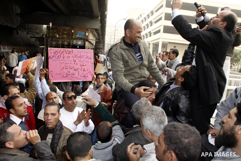 Egyptian protesters take part in a rally in front of the postal authority in Cairo, Egypt, Wedneday, Feb. 16, 2011. Photo by Ahmed Asad