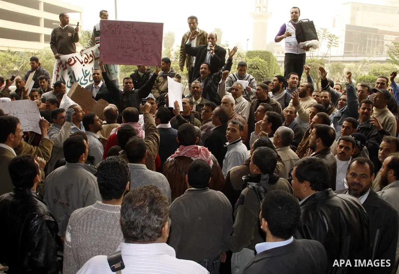 Egyptian protesters take part in a rally in front of the postal authority in Cairo, Egypt, Wedneday, Feb. 16, 2011. Photo by Ahmed Asad