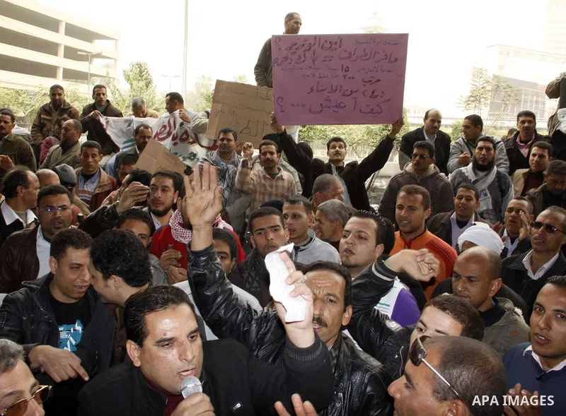 Egyptian protesters take part in a rally in front of the postal authority in Cairo, Egypt, Wedneday, Feb. 16, 2011. Photo by Ahmed Asad