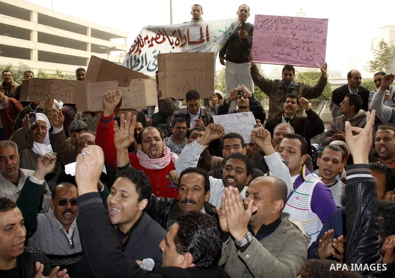 Egyptian protesters take part in a rally in front of the postal authority in Cairo, Egypt, Wedneday, Feb. 16, 2011. Photo by Ahmed Asad
