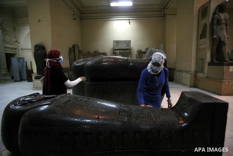 A museum worker cleans in the Egyptian Museum in preparations for its reopening in Cairo, Egypt, Wednesday Feb. 16, 2011. According to Dr. Zahi Hawass, Director for the Supreme Council of Antiquities , thieves entered th...