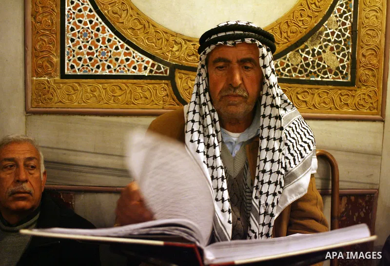 Palestinians take part in Ibrahimi mosque as they march in a procession to mark the birth anniversary of Islam's prophet Mohammed, in the West Bank city of Hebron Tuesday, Feb. 16, 2011. Muslims celebrate Prophet Mohamme...