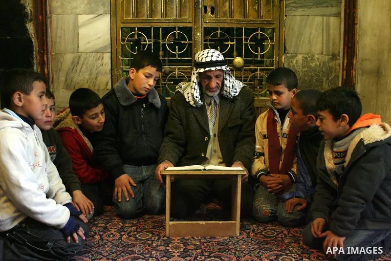 Palestinians take part in Ibrahimi mosque as they march in a procession to mark the birth anniversary of Islam's prophet Mohammed, in the West Bank city of Hebron Tuesday, Feb. 16, 2011. Muslims celebrate Prophet Mohamme...
