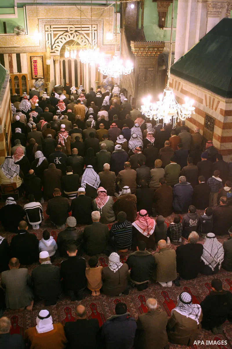 Palestinians take part in Ibrahimi mosque as they march in a procession to mark the birth anniversary of Islam's prophet Mohammed, in the West Bank city of Hebron Tuesday, Feb. 16, 2011. Muslims celebrate Prophet Mohamme...