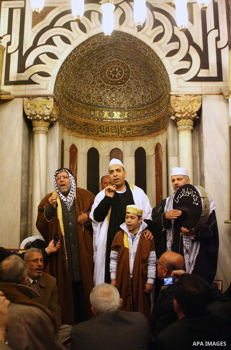 Palestinians take part in Ibrahimi mosque as they march in a procession to mark the birth anniversary of Islam's prophet Mohammed, in the West Bank city of Hebron Tuesday, Feb. 16, 2011. Muslims celebrate Prophet Mohamme...