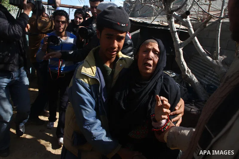 A relative of Jihad Khalaf, 20, one of the three Palestinians who were shot dead by Israeli forces, cries during his funeral in Beit Lahia, northern Gaza Strip, on February 17, 201. The three men were killed overnight by...