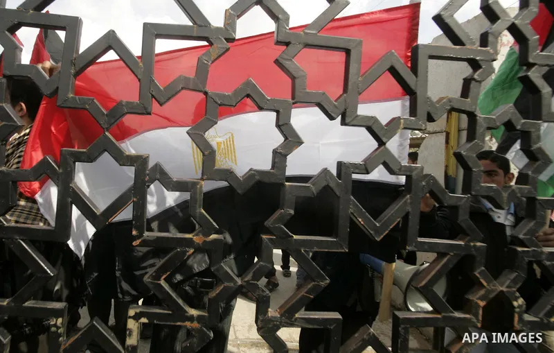 Palestinian youths take part in a march to show support for the Egyptian protesters in Egypt who forced their President Hosni Mubarak to resign, in front of the Rafah border crossing, southern Gaza Strip with Egypt on Fe...