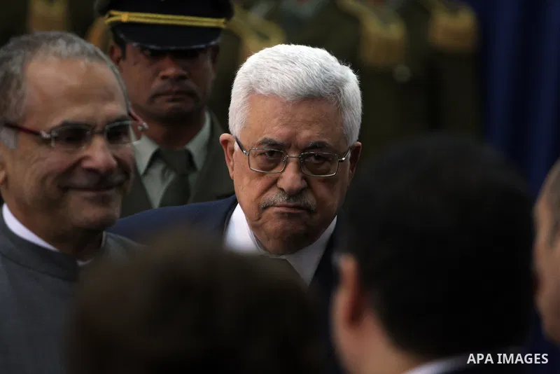 Palestinian President Mahmoud Abbas (C) and East Timor President, Jose Ramos-Horta (L) during the welcome ceremony, as Ramos-Horta arrive to the West Bank city of Ramallah on February 17, 2011. Photo by Issam Rimawi