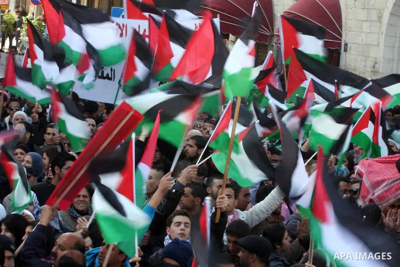 Palestinians take part in a rally calling for ending the Palestinian division, in the West Bank city of Ramallah on Feb. 17, 2011. More than 3000 protesters call for free elections and the reconciliation between the two...