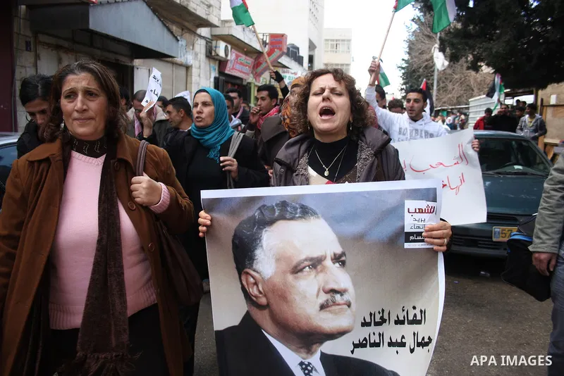 Palestinians take part in a rally calling for ending the Palestinian division, in the West Bank city of Ramallah on Feb. 17, 2011. More than 3000 protesters call for free elections and the reconciliation between the two...