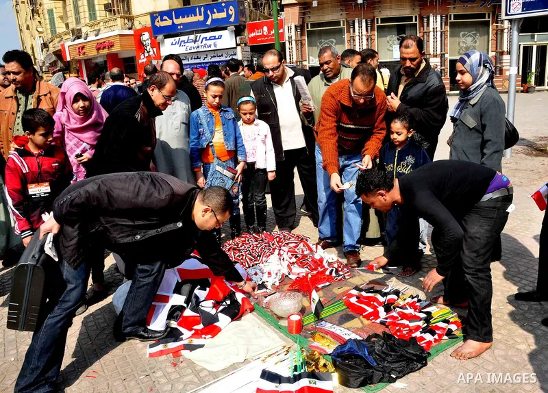 Egyptian people participate in their daily life in Cairo, Egypt on Feb. 17,2011. Mubarak's departure set off a chain reaction around the Middle East, with anti-government demonstrations reported Wednesday in Libya, Bahra...