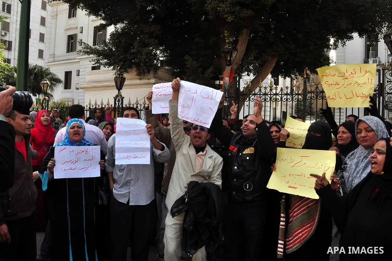 Egyptian people participate in their daily life in Cairo, Egypt on Feb. 17,2011. Mubarak's departure set off a chain reaction around the Middle East, with anti-government demonstrations reported Wednesday in Libya, Bahra...