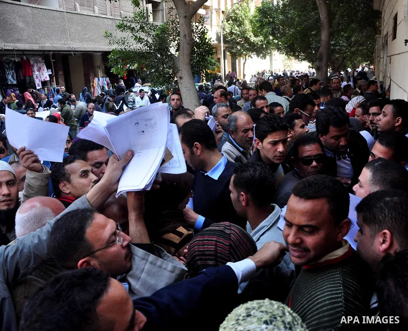 Egyptian people participate in their daily life in Cairo, Egypt on Feb. 17,2011. Mubarak's departure set off a chain reaction around the Middle East, with anti-government demonstrations reported Wednesday in Libya, Bahra...