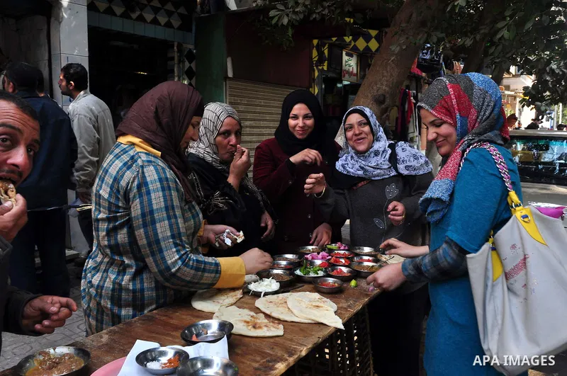 Egyptian people participate in their daily life in Cairo, Egypt on Feb. 17,2011. Mubarak's departure set off a chain reaction around the Middle East, with anti-government demonstrations reported Wednesday in Libya, Bahra...