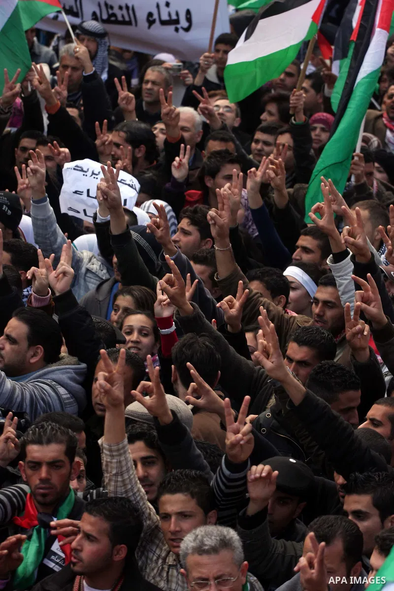 Palestinians take part in a rally calling for ending the Palestinian division, in the West Bank city of Ramallah on Feb. 17, 2011. More than 3000 protesters call for free elections and the reconciliation between the two...