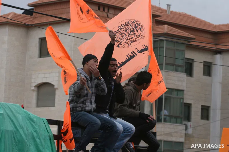 Palestinian National Initiative supporters take part in a demonstration to demand the adoption of "Law of the National Fund for Higher Education" in front of the prime minister building in the West Bank city of Ramallah...
