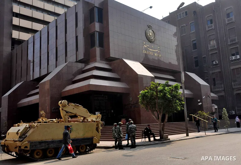 Armored vehicles are seen in front of an Egyptian bank in Cairo, Egypt on Feb 17,2011. Mubarak's departure set off a chain reaction around the Middle East, with anti-government demonstrations reported Wednesday in Libya,...