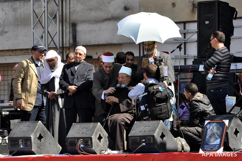 Egyptian cleric Sheik Youssef el-Qaradawi leads Friday prayers in Tahrir Square in Cairo, Egypt, Friday Feb. 18, 2011. Tens of thousands of flag-waving Egyptians packed into Tahrir Square for a day of prayer and celebrat...