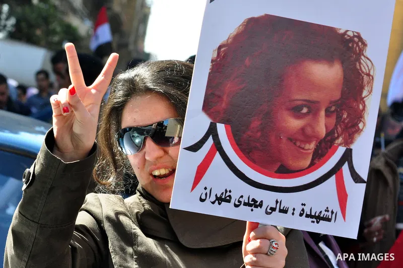 An Egyptian woman attends a march at Tahrir Square in Cairo, Egypt, Feb. 18, 2011. Tens of thousands of flag-waving Egyptians packed into Tahrir Square for a day of prayer and celebration Friday to mark the fall of Hosni...