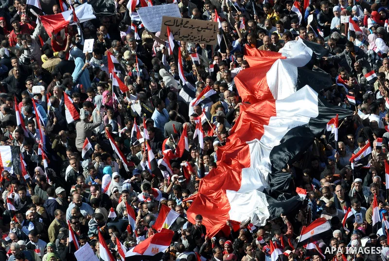 Thousands attend Friday prayers and a demonstration in Tahrir Square in Cairo, Egypt, Friday Feb. 18, 2011. Tens of thousands of flag-waving Egyptians packed into Tahrir Square for a day of prayer and celebration Friday...