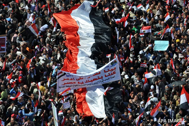 Thousands attend Friday prayers and a demonstration in Tahrir Square in Cairo, Egypt, Friday Feb. 18, 2011. Tens of thousands of flag-waving Egyptians packed into Tahrir Square for a day of prayer and celebration Friday...