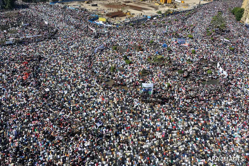 Thousands attend Friday prayers and a demonstration in Tahrir Square in Cairo, Egypt, Friday Feb. 18, 2011. Tens of thousands of flag-waving Egyptians packed into Tahrir Square for a day of prayer and celebration Friday...