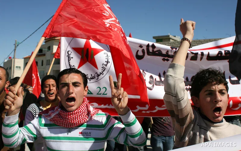 Palestinian, Israeli and International protesters take part in a demonstration against Israel's controversial separation barrier in the West Bank village of Maasarah, near the biblical town of Bethlehem on 18 February 20...