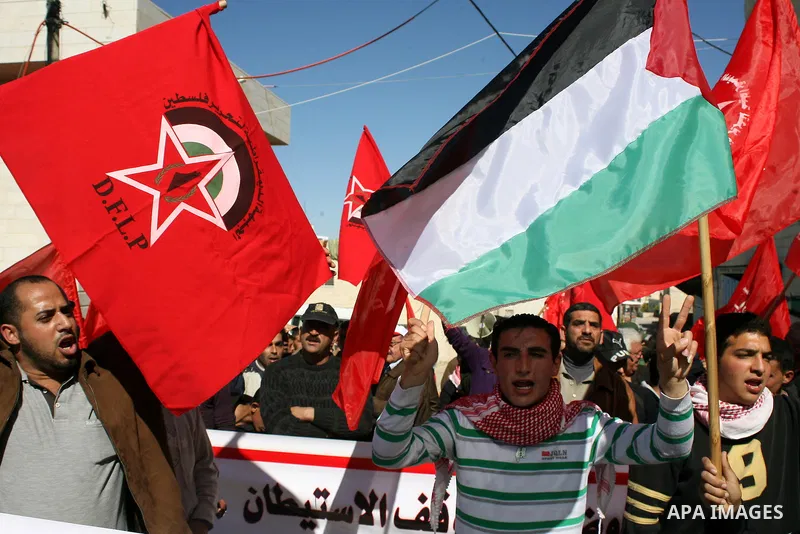 Palestinian, Israeli and International protesters take part in a demonstration against Israel's controversial separation barrier in the West Bank village of Maasarah, near the biblical town of Bethlehem on 18 February 20...