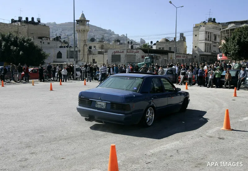 A Palestinian driver takes part in car race in the West Bank city of Nablus, Friday, Feb, 18, 2011. Photo by Wagdi Eshtayah