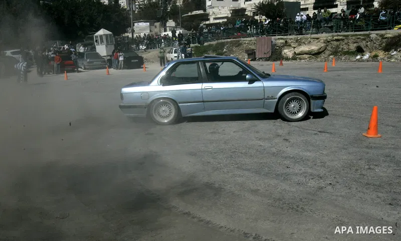 A Palestinian driver takes part in car race in the West Bank city of Nablus, Friday, Feb, 18, 2011. Photo by Wagdi Eshtayah