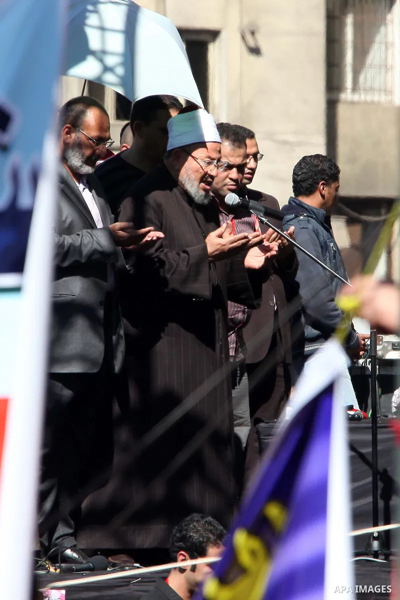 Egyptian cleric Sheik Youssef el-Qaradawi leads Friday prayers in Tahrir Square in Cairo, Egypt, Friday Feb. 18, 2011. Tens of thousands of flag-waving Egyptians packed into Tahrir Square for a day of prayer and celebrat...